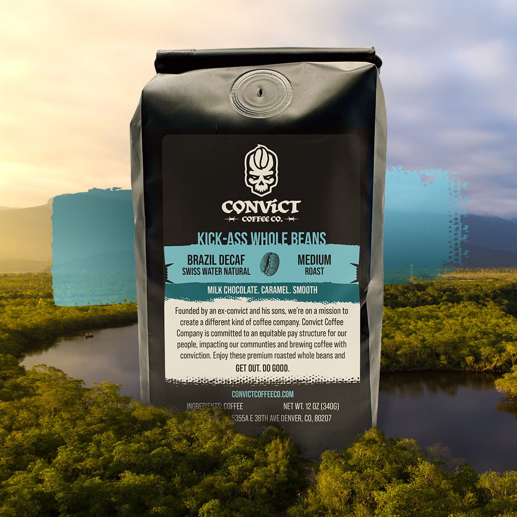 Coffee bag with Convict Coffee Co. branding Brazil Decaf Swiss Water Natural Medium Roast against a scenic background in Brazil