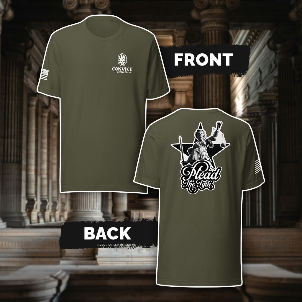 Military Gree t-shirt with 'Convict Coffee Co.' Logo white left chest print, American flag on right sleeve print, and 'Plead The Fifth' Lady Justice holding up scales and sword black and white back print, against a classical architecture background.