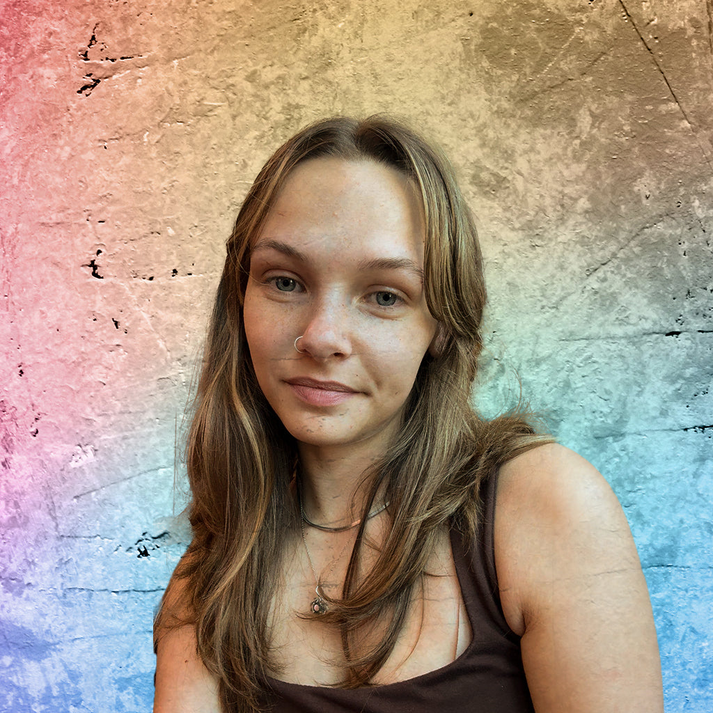 Jadyn Klehm smiling against colorful textured background
