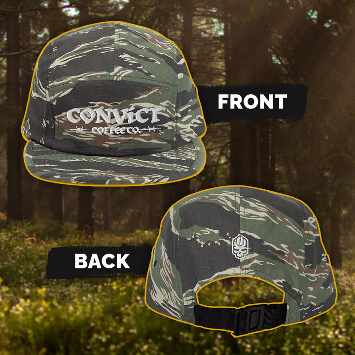 Camouflage cap with visible Convict Coffee Co. branding on a natural background