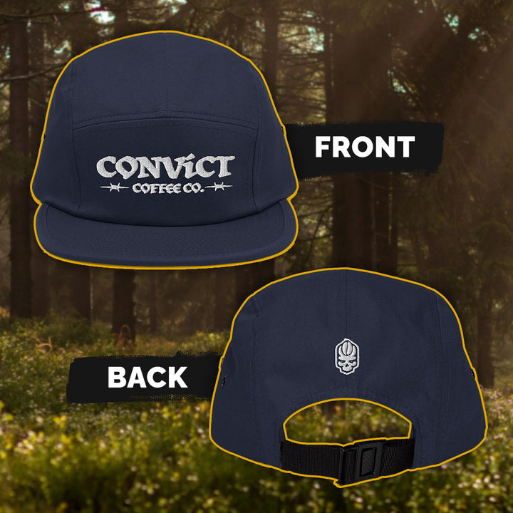 Navy cap with visible Convict Coffee Co. branding on a natural background