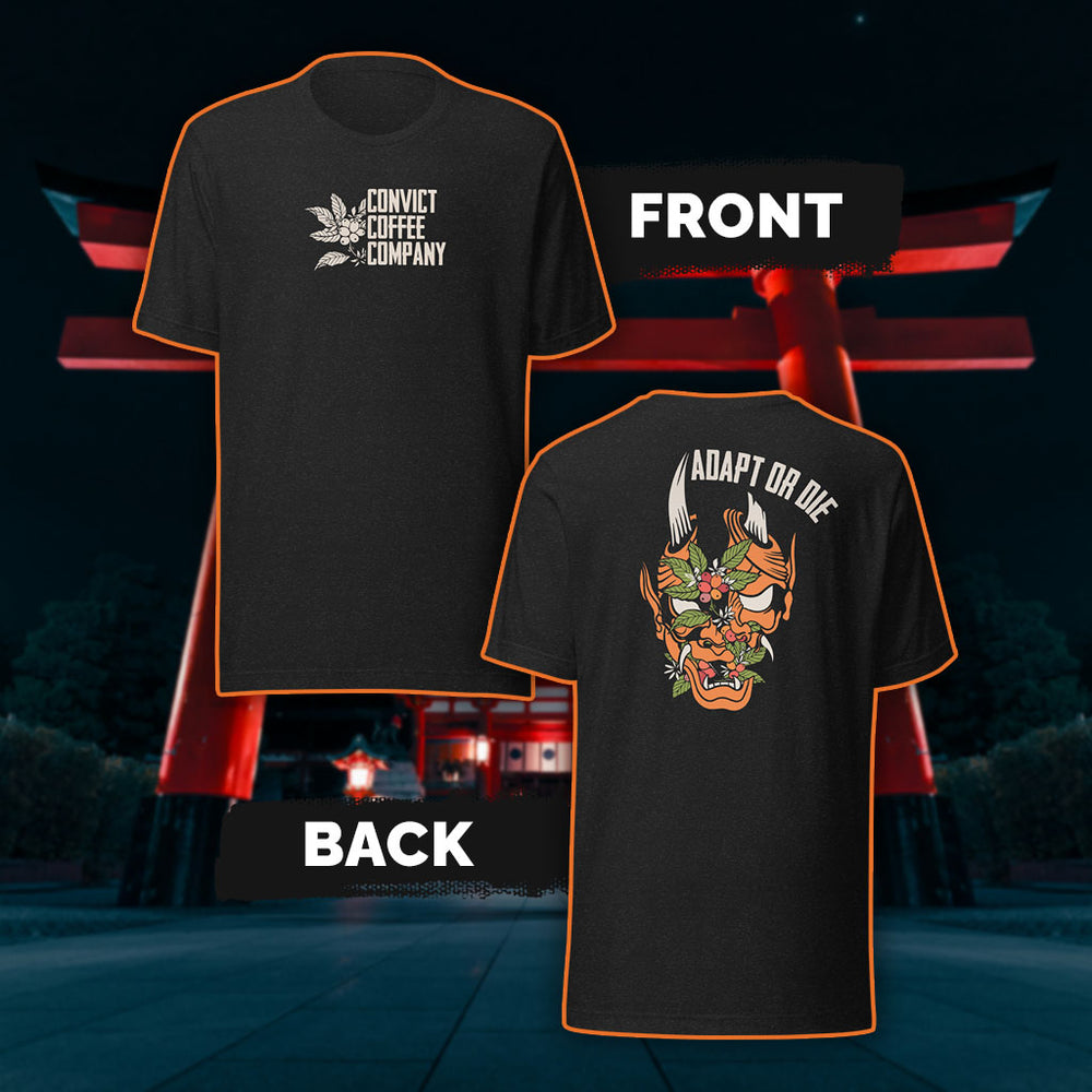 Black Heather tank top with a Japanese Oni and coffee plant design and 'Adapt or Die' text in front of red torii gates.