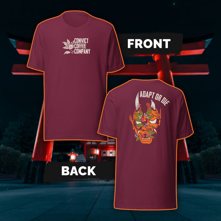 Maroon tank top with a Japanese Oni and coffee plant design and 'Adapt or Die' text in front of red torii gates.
