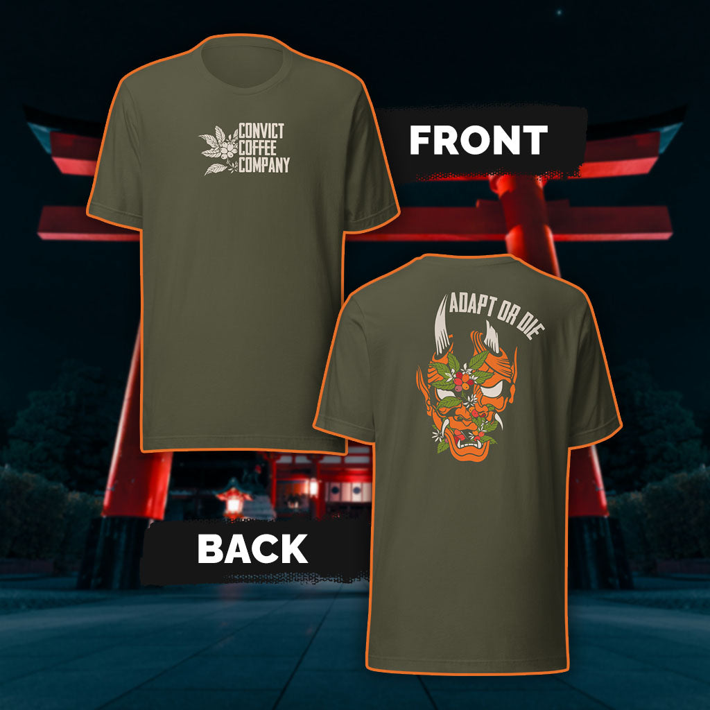 Military Green tank top with a Japanese Oni and coffee plant design and 'Adapt or Die' text in front of red torii gates.