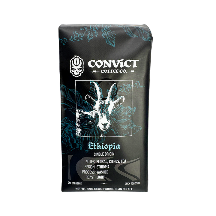 A bag of Convict Coffee Co. Ethiopia single-origin whole bean coffee, featuring a black package with teal floral patterns and a white goat illustration.