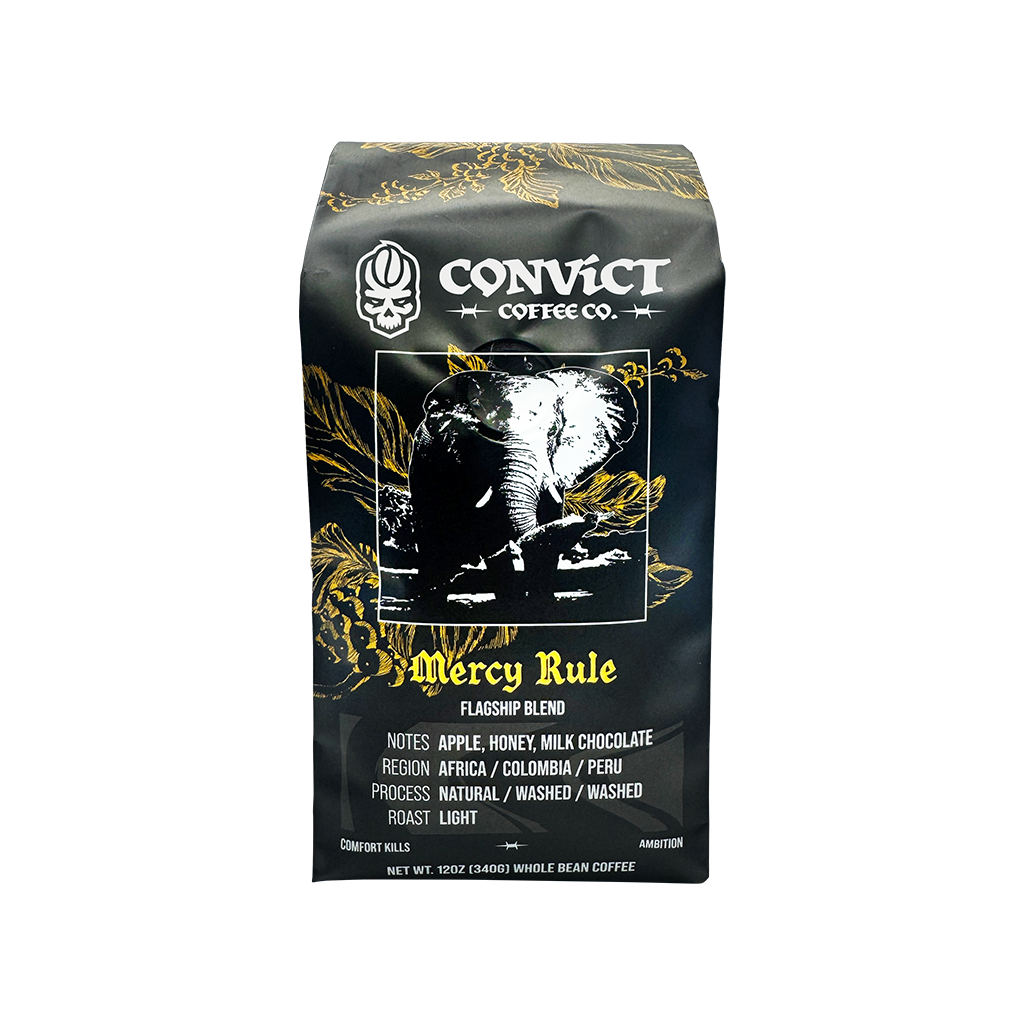 A bag of Convict Coffee Co. Mercy Rule Flagship Blend whole bean coffee on a plain white background.