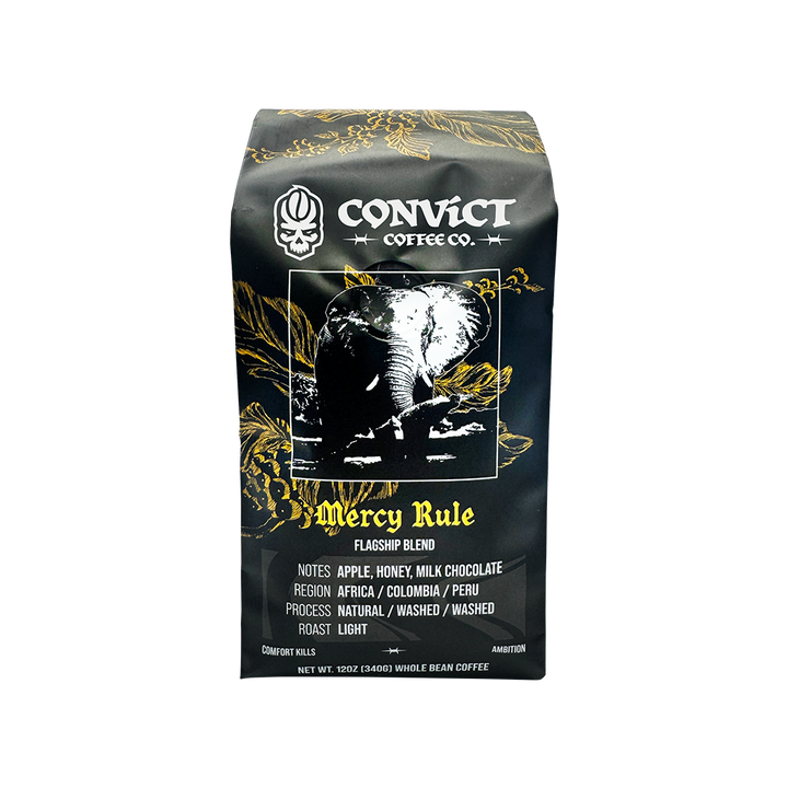 A bag of Convict Coffee Co. Mercy Rule Flagship Blend whole bean coffee on a plain white background.
