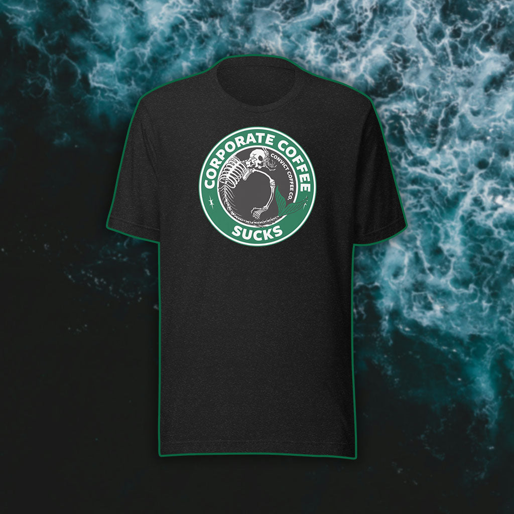 Black Heather t-shirt with a green, black, and white 'Corporate Coffee Sucks' design with dead mermaid print on a dark water background