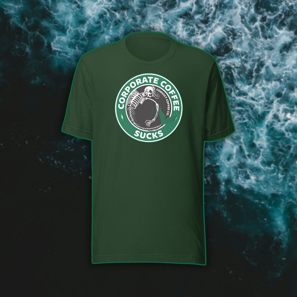Forest t-shirt with a green, black, and white 'Corporate Coffee Sucks' design with dead mermaid print on a dark water background