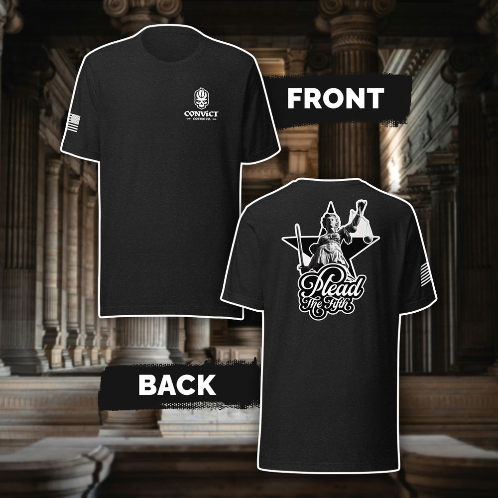 Black Heather t-shirt with 'Convict Coffee Co.' Logo white left chest print, American flag on right sleeve print, and 'Plead The Fifth' Lady Justice holding up scales and sword black and white back print, against a classical architecture background.
