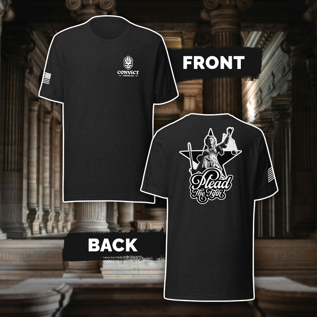 Black Heather t-shirt with 'Convict Coffee Co.' Logo white left chest print, American flag on right sleeve print, and 'Plead The Fifth' Lady Justice holding up scales and sword black and white back print, against a classical architecture background.