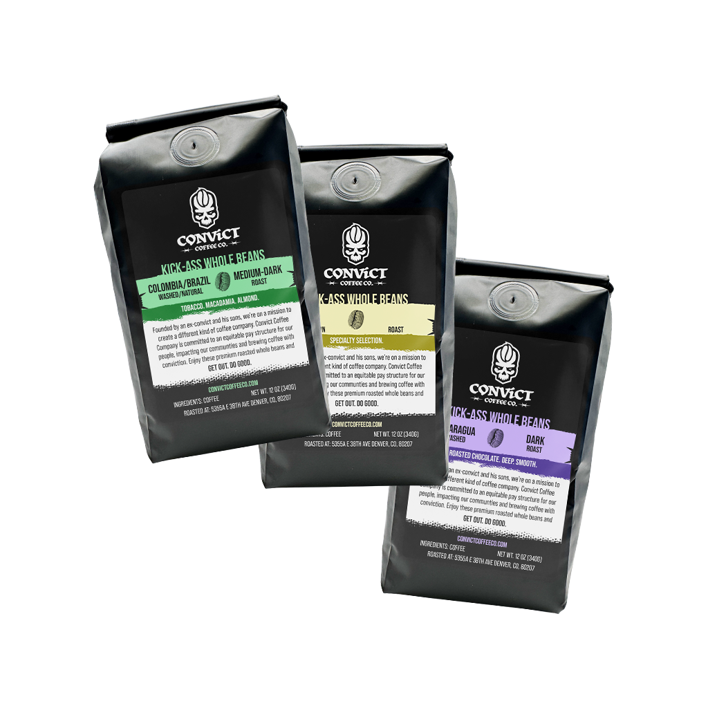 Three black coffee bags with visible coffee bean fingerprint branding on a transparent background