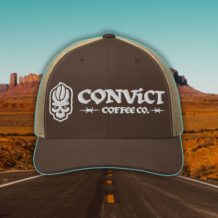 Brown and Khaki Trucker Hat with 'Convict Coffee Co.' logo white embroidery on a Desert Road background