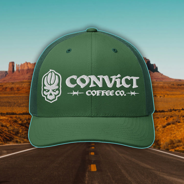 Evergreen Hat with 'Convict Coffee Co.' logo white embroidery on a Desert Road background